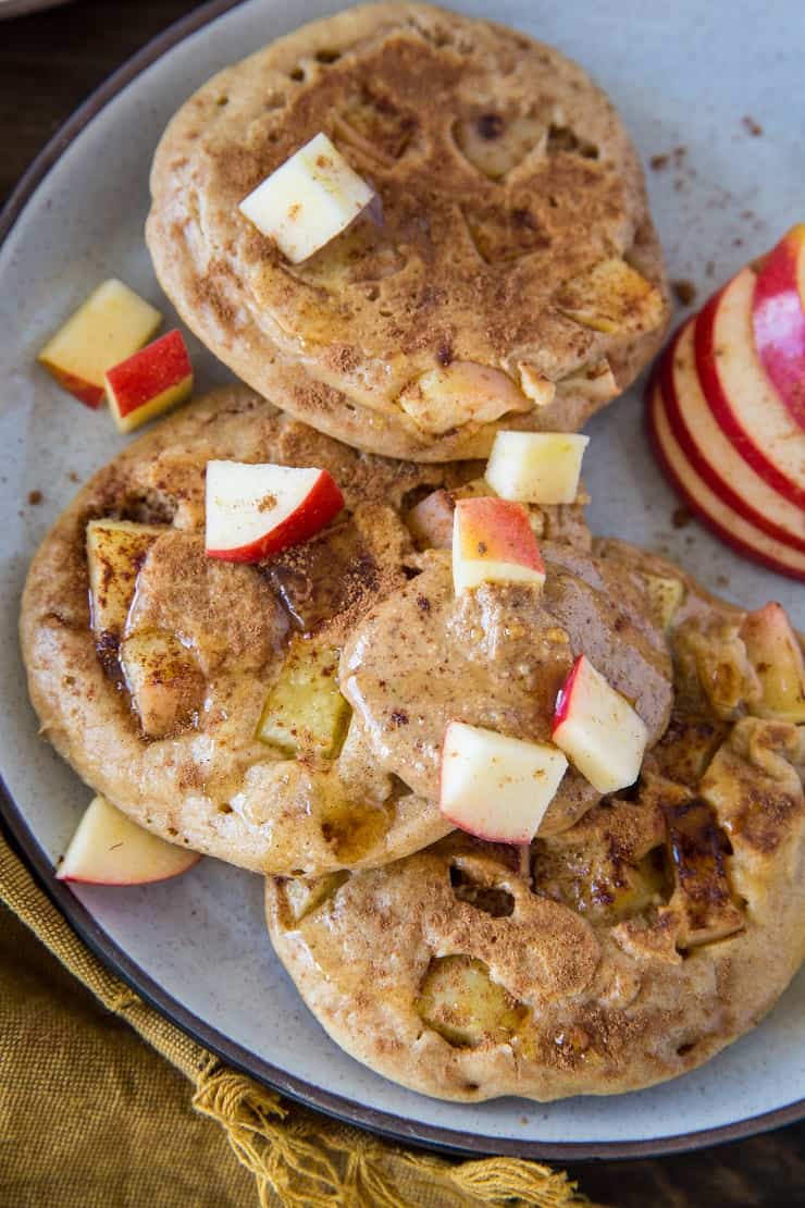 Paleo Apple Cinnamon Pancakes made with almond flour and tapioca flour. This super fluffy grain-free pancake recipe is a pure delight! | TheRoastedRoot.net #glutenfree #breakfast #healthy