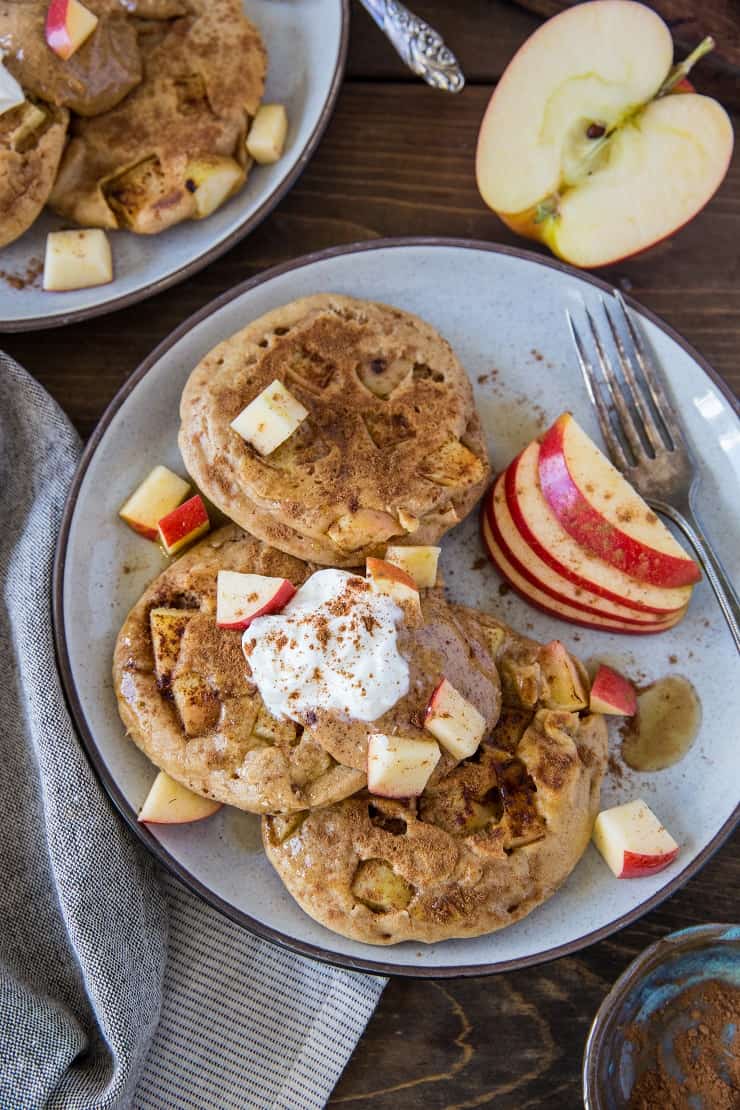 Paleo Apple Cinnamon Pancakes made with almond flour and tapioca flour. This super fluffy grain-free pancake recipe is a pure delight! | TheRoastedRoot.net #glutenfree #breakfast #healthy