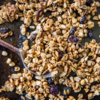 Gluten-Free Pumpkin Spice Granola with real pumpkin puree, pure maple syrup, nuts, and seeds. A marvelous fall and winter breakfast or snack | TheRoastedRoot.net #healthy #breakfast #recipe