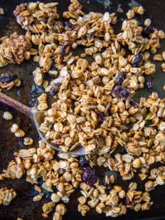 Gluten-Free Pumpkin Spice Granola with real pumpkin puree, pure maple syrup, nuts, and seeds. A marvelous fall and winter breakfast or snack | TheRoastedRoot.net #healthy #breakfast #recipe