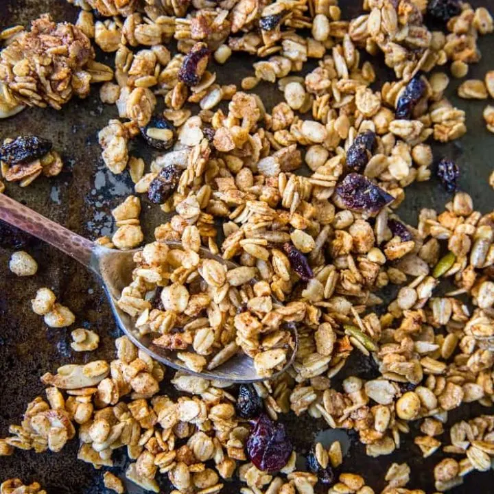 Gluten-Free Pumpkin Spice Granola with real pumpkin puree, pure maple syrup, nuts, and seeds. A marvelous fall and winter breakfast or snack | TheRoastedRoot.net #healthy #breakfast #recipe