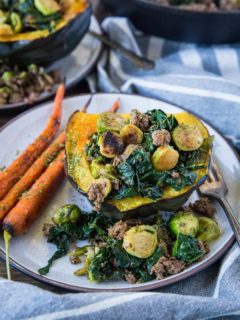 Stuffed Acorn Squash with Ground Beef, Brussels Sprouts, and Kale - a clean, nutritious dinner recipe that's paleo, low-carb, and whole30 | TheRoastedRoot.net #glutenfree