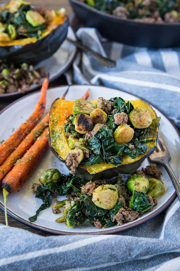 Stuffed Acorn Squash with Ground Beef, Brussels Sprouts, and Kale - a clean, nutritious dinner recipe that's paleo, low-carb, and whole30 | TheRoastedRoot.net #glutenfree