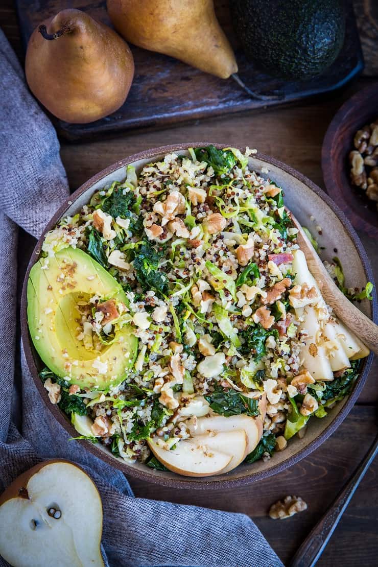 Warm Brussles Sprouts Salad with Kale, Quinoa, Pears, and Bacon Vinaigrette - an incredibly nutritious salad or side dish to share with friends and family | TheRoastedRoot.com #glutenfree #healthyrecipe