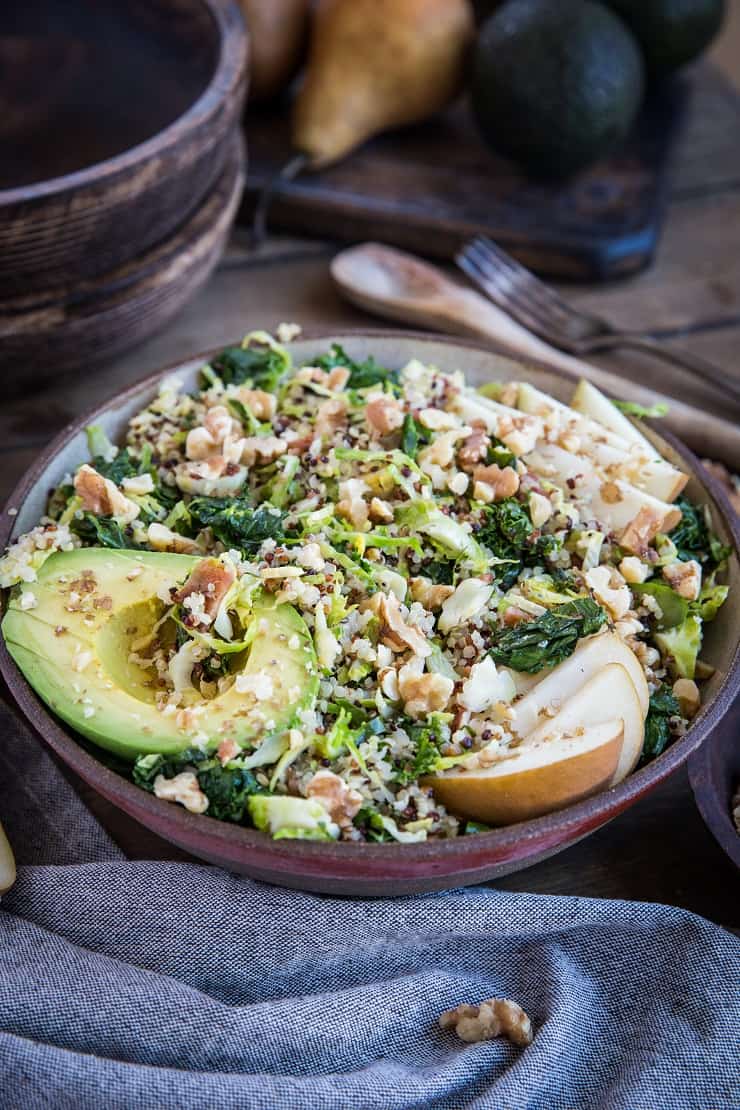 Warm Brussles Sprouts Salad with Kale, Quinoa, Pears, and Bacon Vinaigrette - an incredibly nutritious salad or side dish to share with friends and family | TheRoastedRoot.com #glutenfree #healthyrecipe