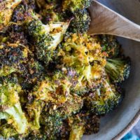 "Cheesy" Vegan Crispy Broccoli - an easy dairy-free roasted broccoli recipe that has a lovely cheesy flavor from nutritional yeast | TheRoastedRoot.com