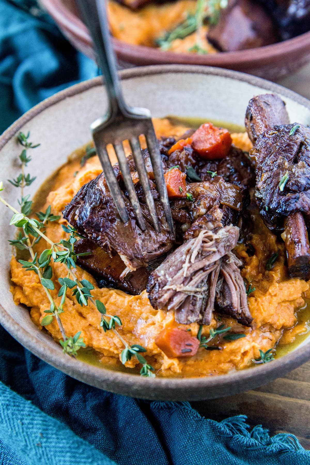 Instant Pot Short Ribs made paleo-friendly with tart cherry juice. Serve them atop mashed sweet potatoes for a delicious complete meal. | TheRoastedRoot.com #grainfree #glutenfree #healthyrecipe