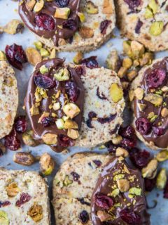 Cranberry Pistachio Vegan Shortbread Cookies - paleo, grain-free, dairy-free, refined sugar-free and absolutely delicious! These are the perfect Christmas cookie and are amazing when dipped in chocolate