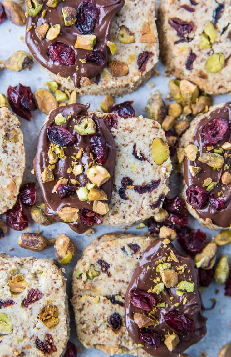 Cranberry Pistachio Vegan Shortbread Cookies - paleo, grain-free, dairy-free, refined sugar-free and absolutely delicious! These are the perfect Christmas cookie and are amazing when dipped in chocolate