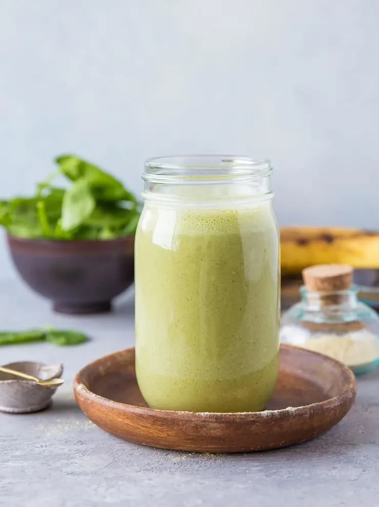 Green Adaptogenic Protein Smoothie - a calming, nutrient-rich meal in a glass with all sorts of health benefits | TheRoastedRoot.net