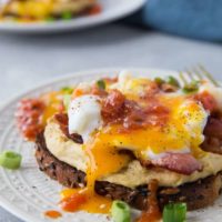 Huevos Rancheros Hummus Toast with soft boiled egg, bacon, and salsa | TheRoastedRoot.net #hummustoast #breakfast