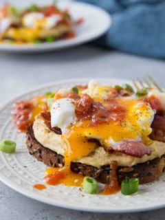 Huevos Rancheros Hummus Toast with soft boiled egg, bacon, and salsa | TheRoastedRoot.net #hummustoast #breakfast