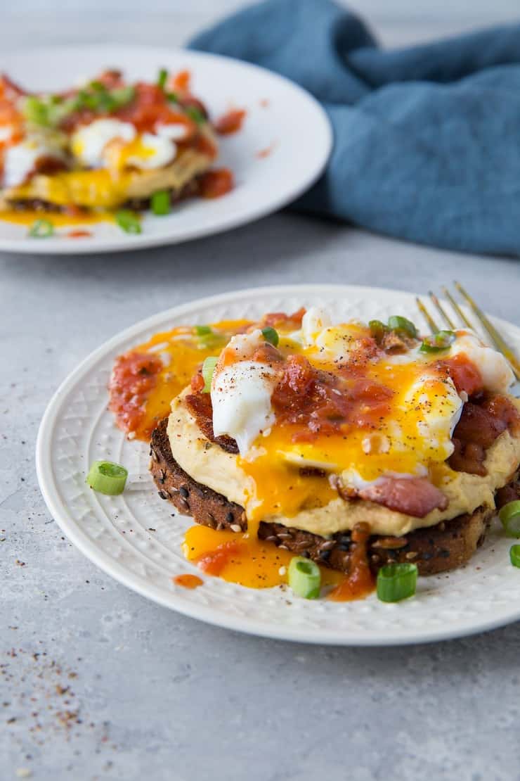 Huevos Rancheros Hummus Toast with soft boiled egg, bacon, and salsa | TheRoastedRoot.net #hummustoast #breakfast