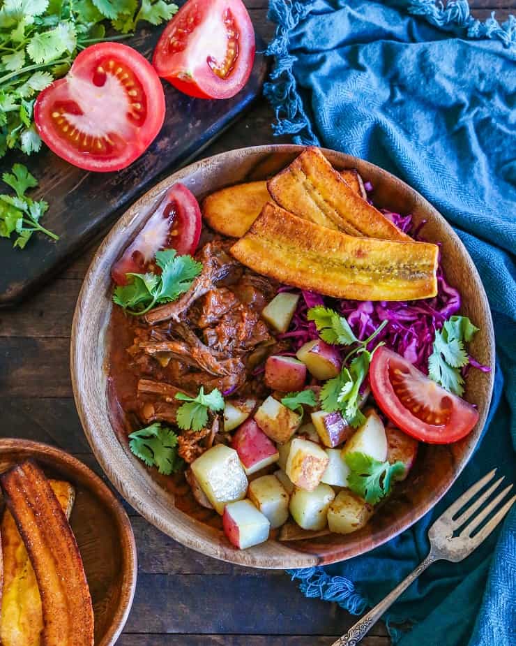 Slow Cooker Ropa Vieja (Cuban Shredded Beef) with Instant Pot instructions. This delicious flavorful dish is paleo, whole30, and versatile! | TheRoastedRoot.net #glutenfree