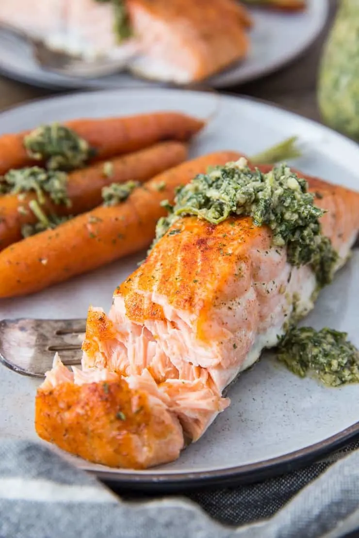 Sheet Pan Salmon and Carrots with Carrot Top Pesto - a whole30, paleo, keto diner recipe that requires just 35 minutes to make! | TheRoastedRoot.net