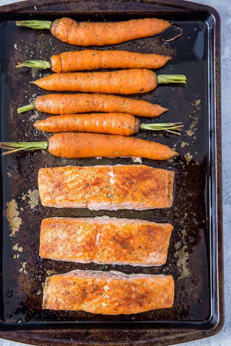 Sheet Pan Salmon and Carrots with Carrot Top Pesto - a whole30, paleo, keto diner recipe that requires just 35 minutes to make! | TheRoastedRoot.net