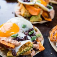 Crispy Avocado Breakfast Tacos with roasted sweet potato, cauliflower, black beans, eggs, and chipotle sauce. A healthy brunch recipe | TheRoastedRoot.net #glutenfree #breakfast