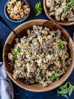 Pesto Chicken Pasta with Broccoli and Mushrooms - an easy, nutritious weeknight meal that only takes 30 minutes to make! | TheRoastedRoot.com