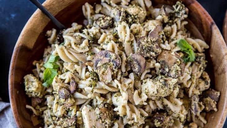 Pesto Chicken Pasta with Broccoli and Mushrooms - an easy, nutritious weeknight meal that only takes 30 minutes to make! | TheRoastedRoot.com