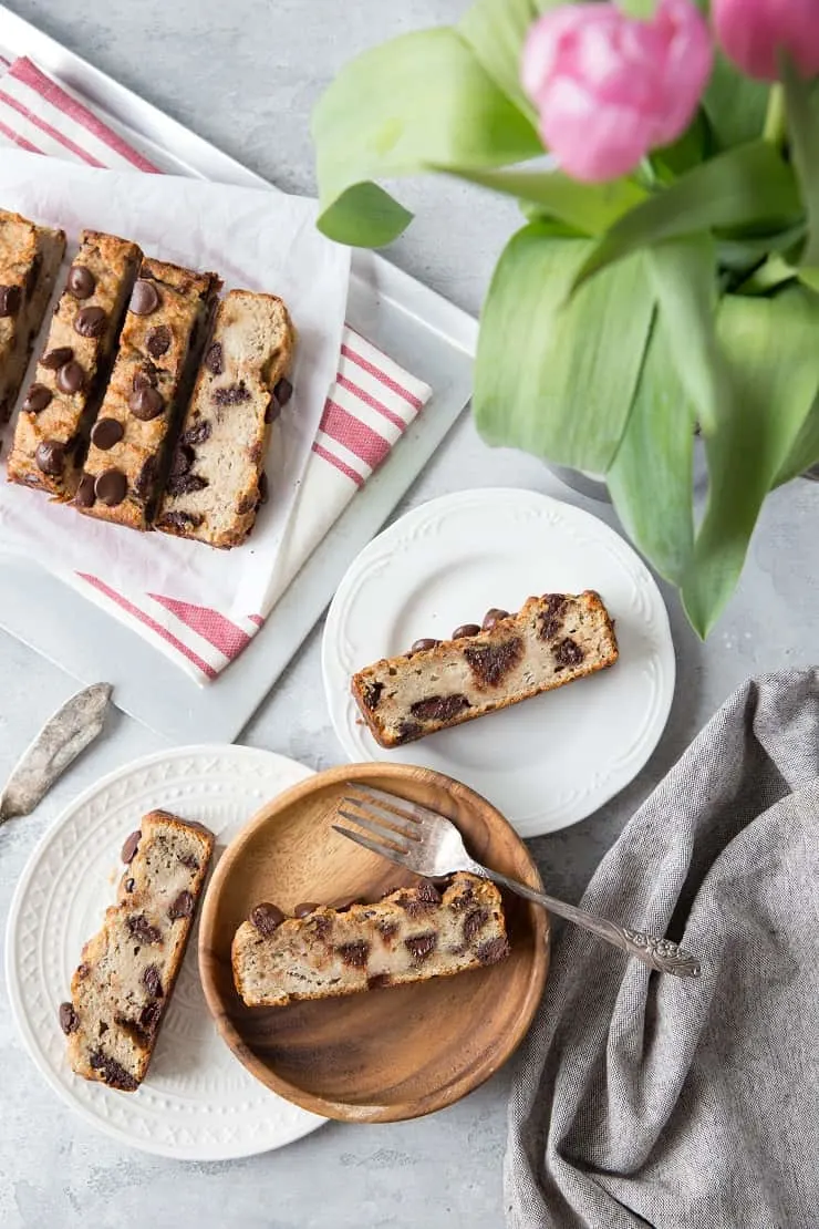 Chocolate Chip Paleo Vegan Banana Bread - a moist and dense healthy recipe that is dairy-free, oil-free, and refined sugar-free | TheRoastedRoot.net #vegan #glutenfree #grainfree #vegan