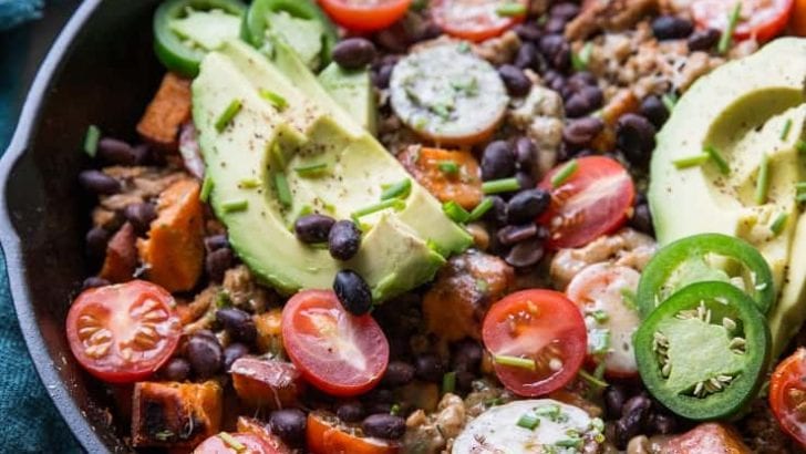 Ground Turkey Taco Skillet with black beans, sweet potato, tomatoes, cheese, avocados, and chives - an easy, clean, healthy dinner recipe ready in just 30 minutes | TheRoastedRoot.net
