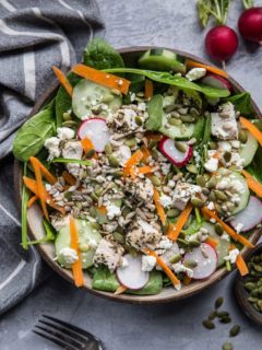 Lemon Herb Baked Chicken Spinach Salad with pumpkin seeds, radishes, cucumbers, feta, and carrots - an easy healthy Low-FODMAP salad recipe | TheRoastedRoot.net