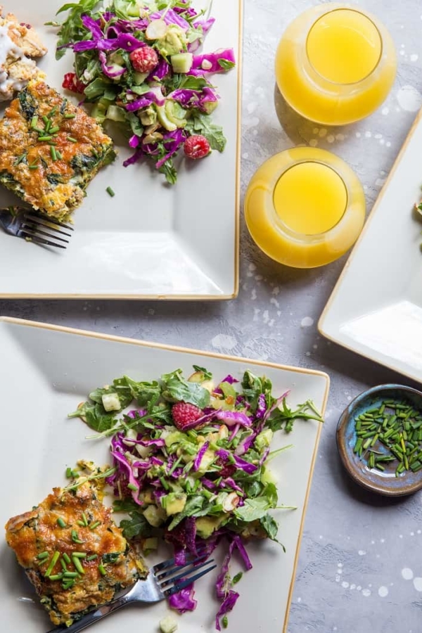 three plates with breakfast casserole and salad
