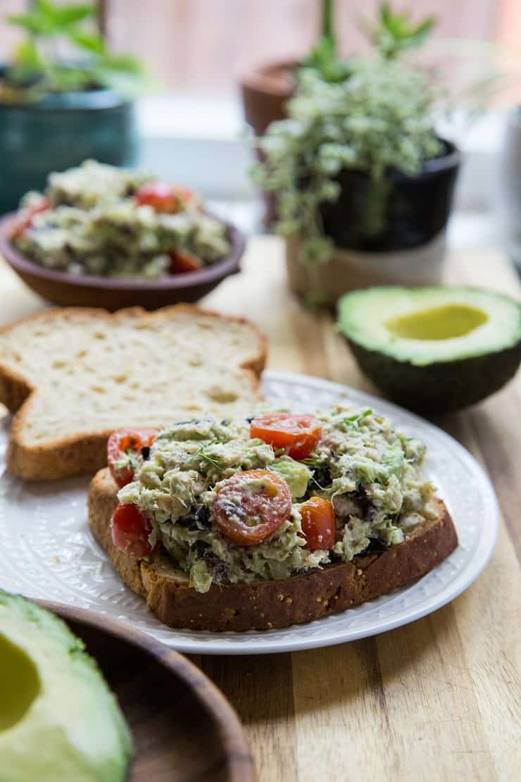 Healthy Tuna Salad made with fresh Greek-inspired ingredients including avocado, cherry tomatoes, kalamata olives, cucumber and fetafor a healthy lunch | TheRoastedRoot.net #keto #paleo #lowcarb 