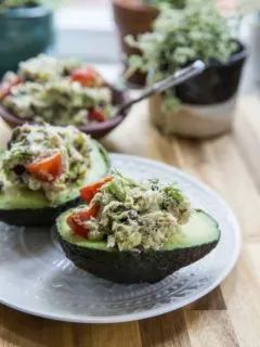 Healthy Greek Tuna Salad Stuffed Avocadosmade with fresh ingredients for a healthy lunch | TheRoastedRoot.net #keto #paleo #lowcarb