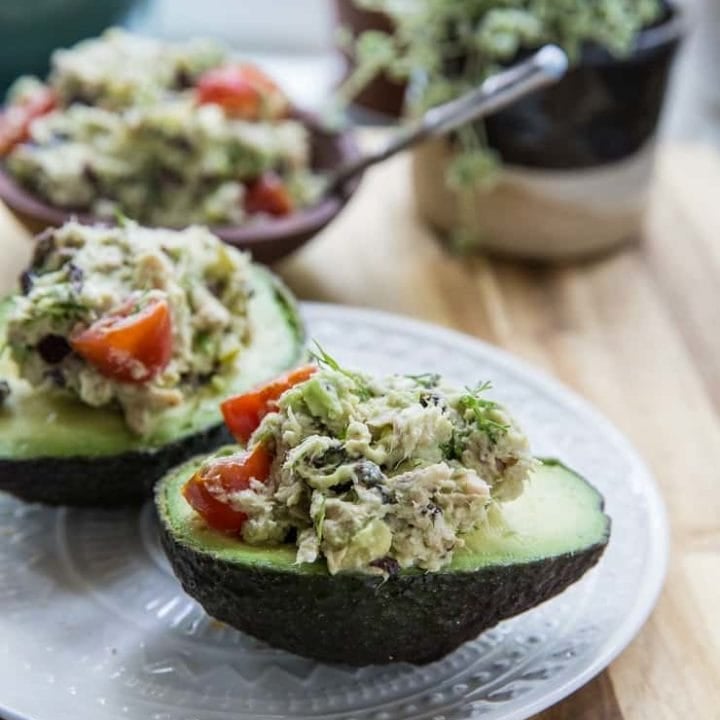 Healthy Greek Tuna Salad Stuffed Avocadosmade with fresh ingredients for a healthy lunch | TheRoastedRoot.net #keto #paleo #lowcarb