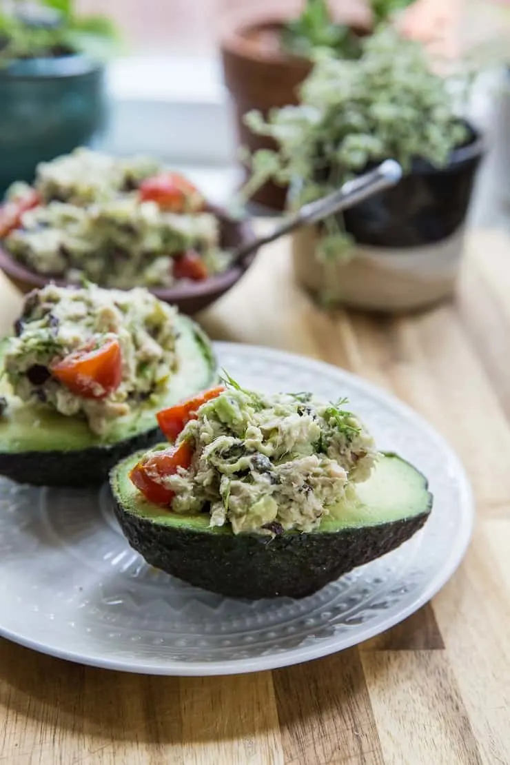 Healthy Greek Tuna Salad Stuffed Avocadosmade with fresh ingredients for a healthy lunch | TheRoastedRoot.net #keto #paleo #lowcarb