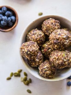 Superfood Blueberry Dark Chocolate Energy Balls made with walnuts, almonds, dates, flax seed oil, and more! A healthy snack recipe | TheRoastedRoot.net #paleo #vegan #healthy