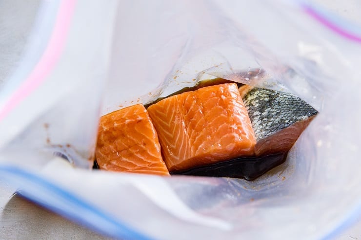 Teriyaki salmon marinating in sauce