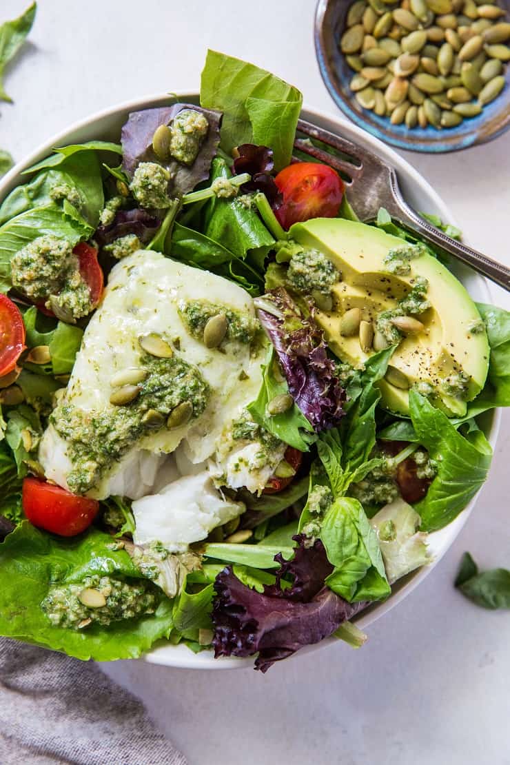 Cod Salad with Basil-Walnut Pesto, cherry tomatoes, pumpkin seeds and avocado - a low-carb, keto, paleo, whole30 dinner recipe | TheRoastedRoot.net