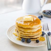 Paleo vegan pancakes that are grain-free, dairy-free, and made with almond flour. This healthy gluten-free pancake recipe is made easily in your blender and results in fluffy, moist pancakes.