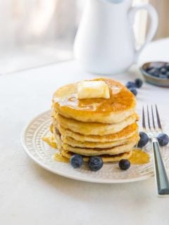 Paleo vegan pancakes that are grain-free, dairy-free, and made with almond flour. This healthy gluten-free pancake recipe is made easily in your blender and results in fluffy, moist pancakes.