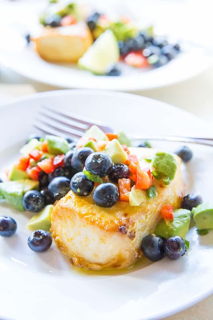 Orange Ginger Halibut with Blueberry Avocado Salsa - a baked halibut recipe that is easy to prepare and so flavorful! A healthy dinner recipe - paleo, whole30, low-carb | TheRoastedRoot.net