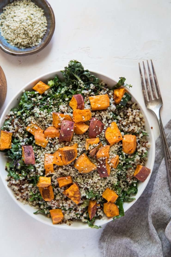 Roasted Sweet Potato Kale Salad with Quinoa, hemp seeds, and honey mustard dressing | TheRoastedRoot.net