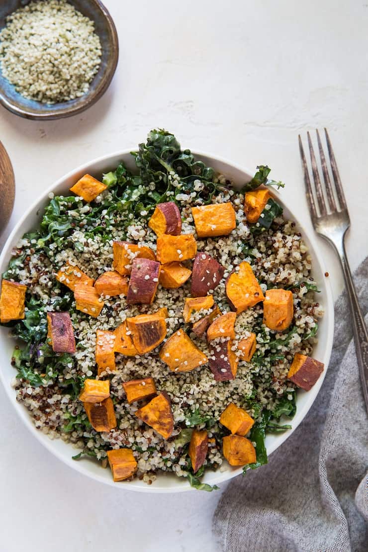 Roasted Sweet Potato Kale Salad with Quinoa, hemp seeds, and honey mustard dressing | TheRoastedRoot.net