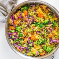 Spaghetti Squash Stir Fry with carrots, broccoli, cabbage, green onion, ginger, and coconut aminos - an easy paleo side dish | TheRoastedRoot.net #glutenfree