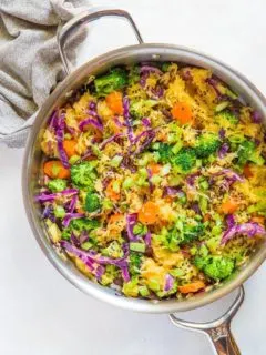 Spaghetti Squash Stir Fry with carrots, broccoli, cabbage, green onion, ginger, and coconut aminos - an easy paleo side dish | TheRoastedRoot.net #glutenfree