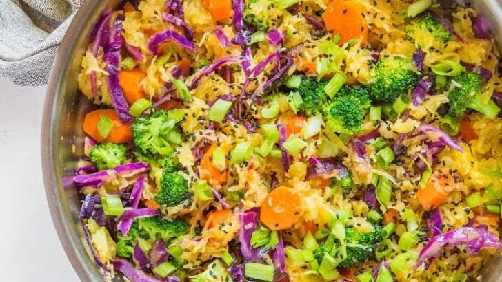 Spaghetti Squash Stir Fry with carrots, broccoli, cabbage, green onion, ginger, and coconut aminos - an easy paleo side dish | TheRoastedRoot.net #glutenfree