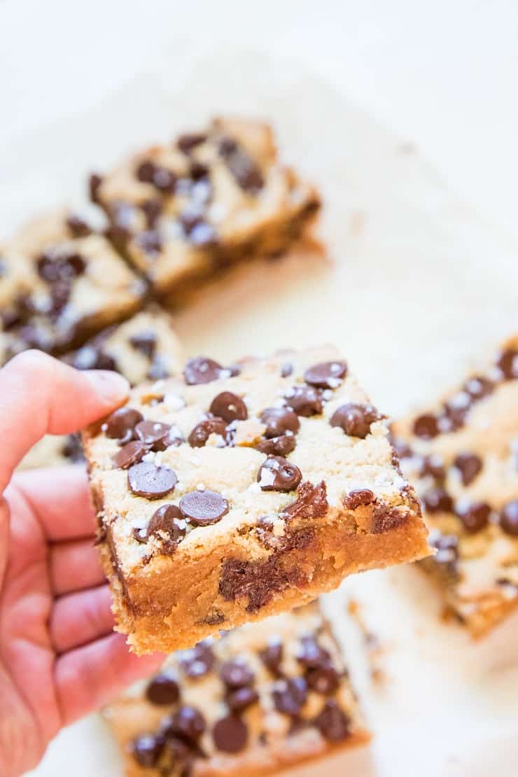 Gluten-Free Peanut Butter Chocolate Chip Cookie Bars - a refined sugar-free cookie bar recipe that will knock your socks off! | TheRoastedRoot.net