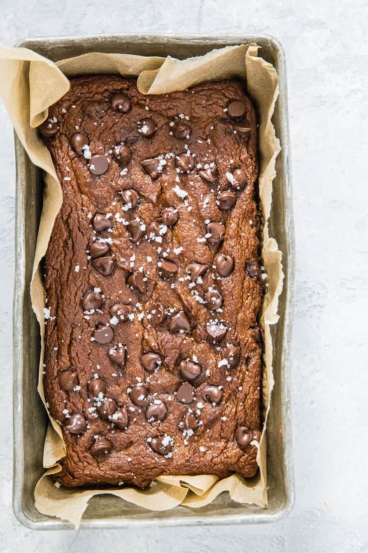 Paleo Pumpkin Quick Bread with chocolate chips and sea salt - a super moist, fluffy, and delicious pumpkin bread recipe made with coconut flour and pure maple syrup | TheRoastedRoot.net