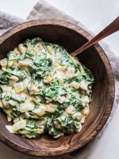 Dairy-Free Creamed Spinach with caramelized onions, garlic, and coconut milk - a healthy side dish! | TheRoastedRoot.net