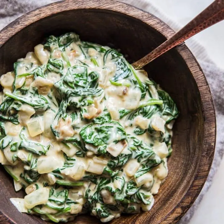 Dairy-Free Creamed Spinach with caramelized onions, garlic, and coconut milk - a healthy side dish! | TheRoastedRoot.net