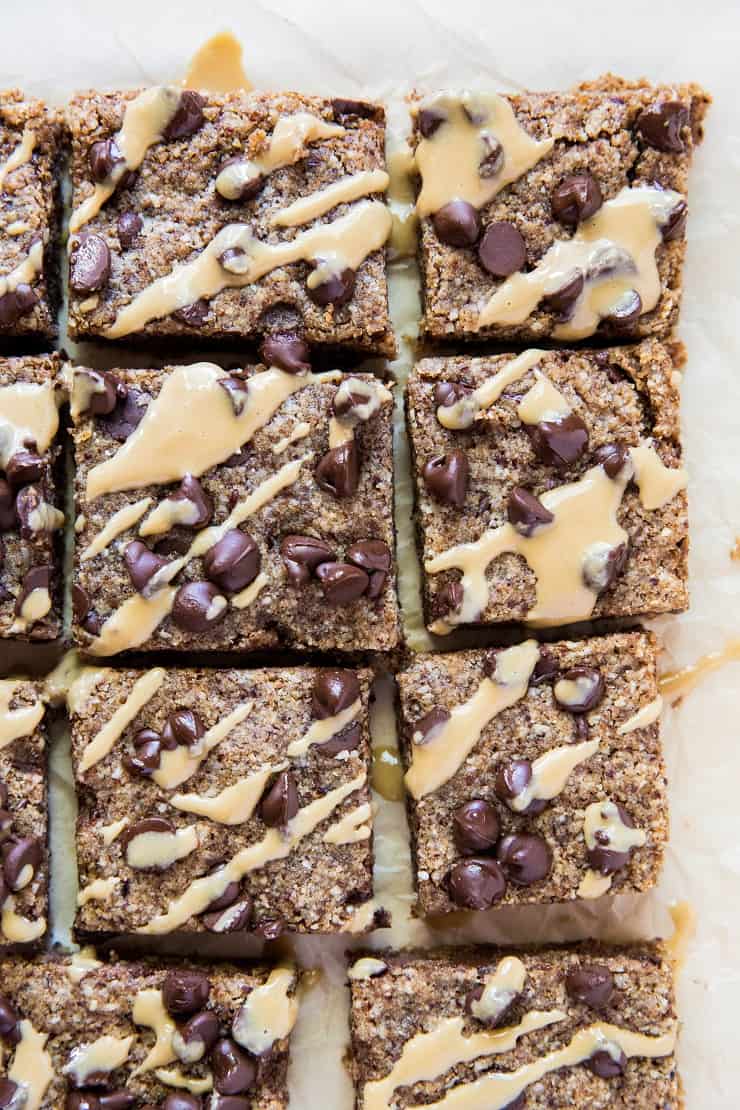 Chocolate Chip Grain-Free Tahini Blondies (aka cookie bars) made with hazelnut flour (or almond flour) and coconut sugar - a refined sugar-free, dairy-free dessert recipe | TheRoastedRoot.net