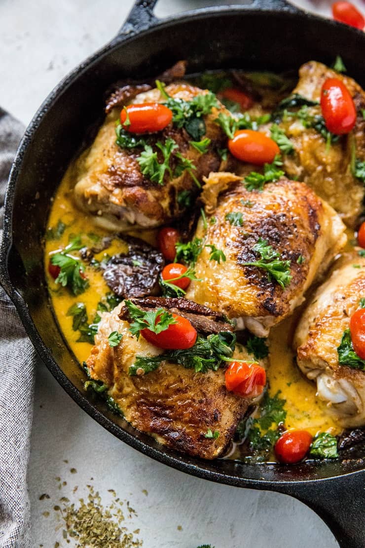 Creamy Tuscan Chicken with Sun-Dried Tomatoes, cherry tomatoes, coconut milk and basil. Paleo, whole30, keto