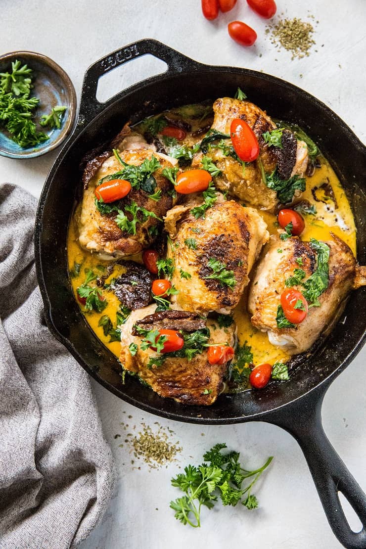 Creamy Tuscan Chicken with Sun-Dried Tomatoes, cherry tomatoes, coconut milk and basil. Paleo, whole30, keto