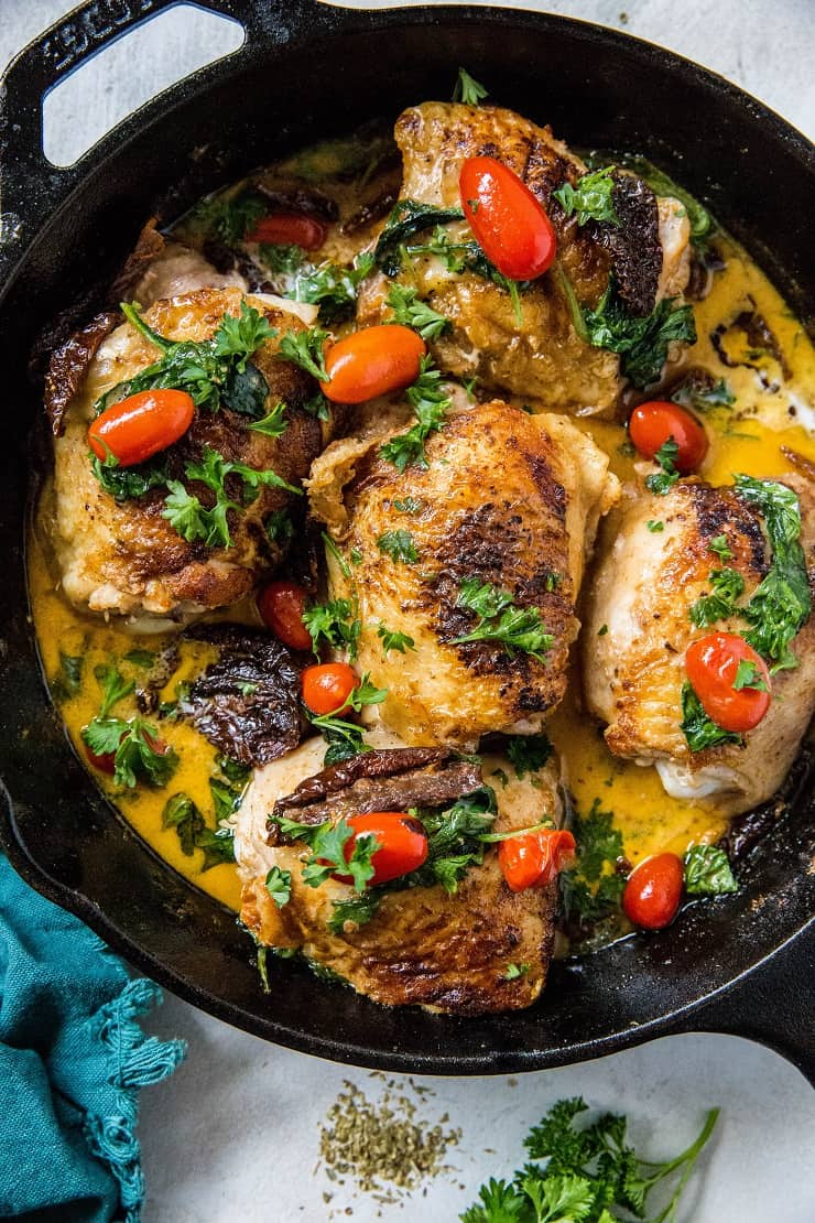 Creamy Tuscan Chicken with Sun-Dried Tomatoes, cherry tomatoes, coconut milk and basil. Paleo, whole30, keto